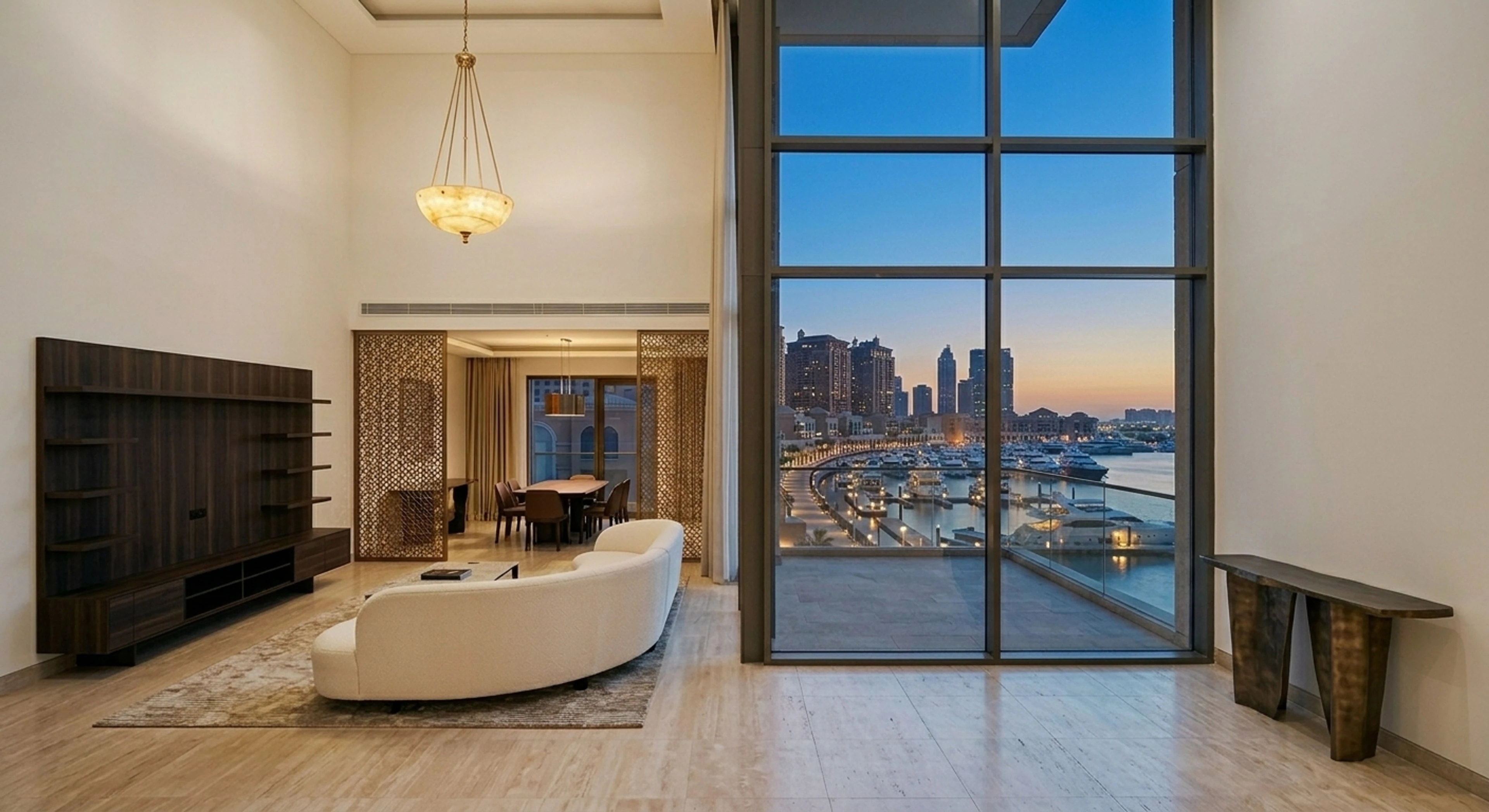 A marina-front duplex on The Pearl, its double-height glass wall opening onto a mirrored harbour of superyachts at blue hour. — enhanced by Plotpane